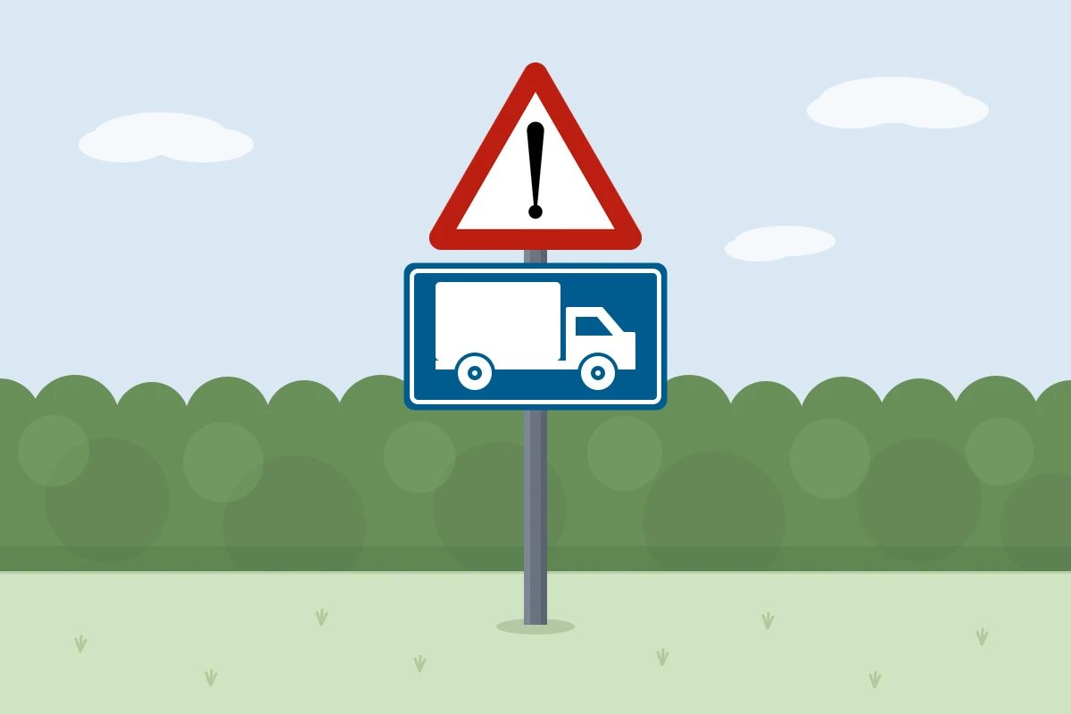 Een gevaarsbord met daaronder een onderbord met een vrachtwagen: een uitrit voor vrachtwagens.